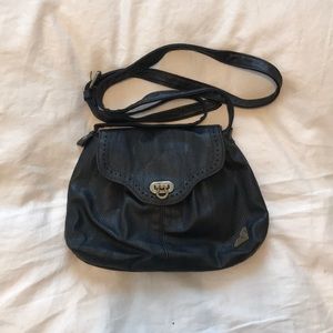 Crossbody bag with decorative detail and flap